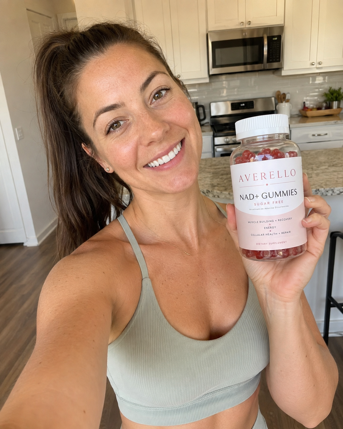 Alexis M. holding a bottle of Averello NAD+ Gummies